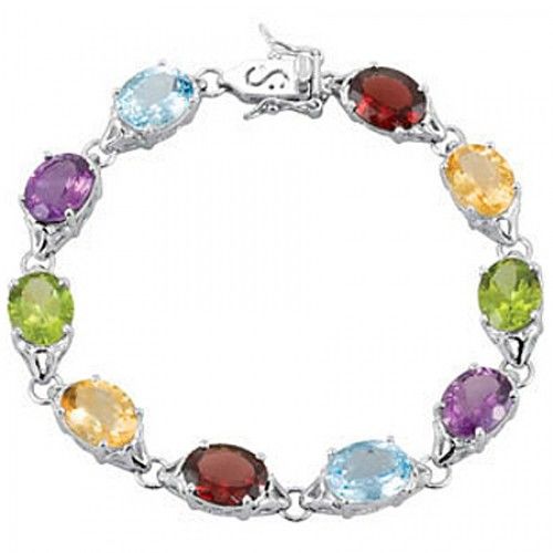 Oval Shape Blue Topaz, Peridot and Garnet Bracelet in Sterling Silver - Superb