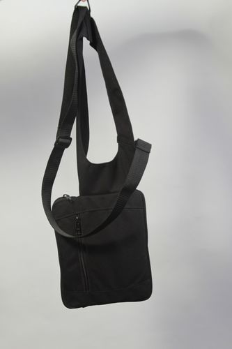 A Shoulder Holster-  Carry this one aboard air-craft, & keep items close. Conceals your tablet, medical supplies, or what ever, because you wear it li